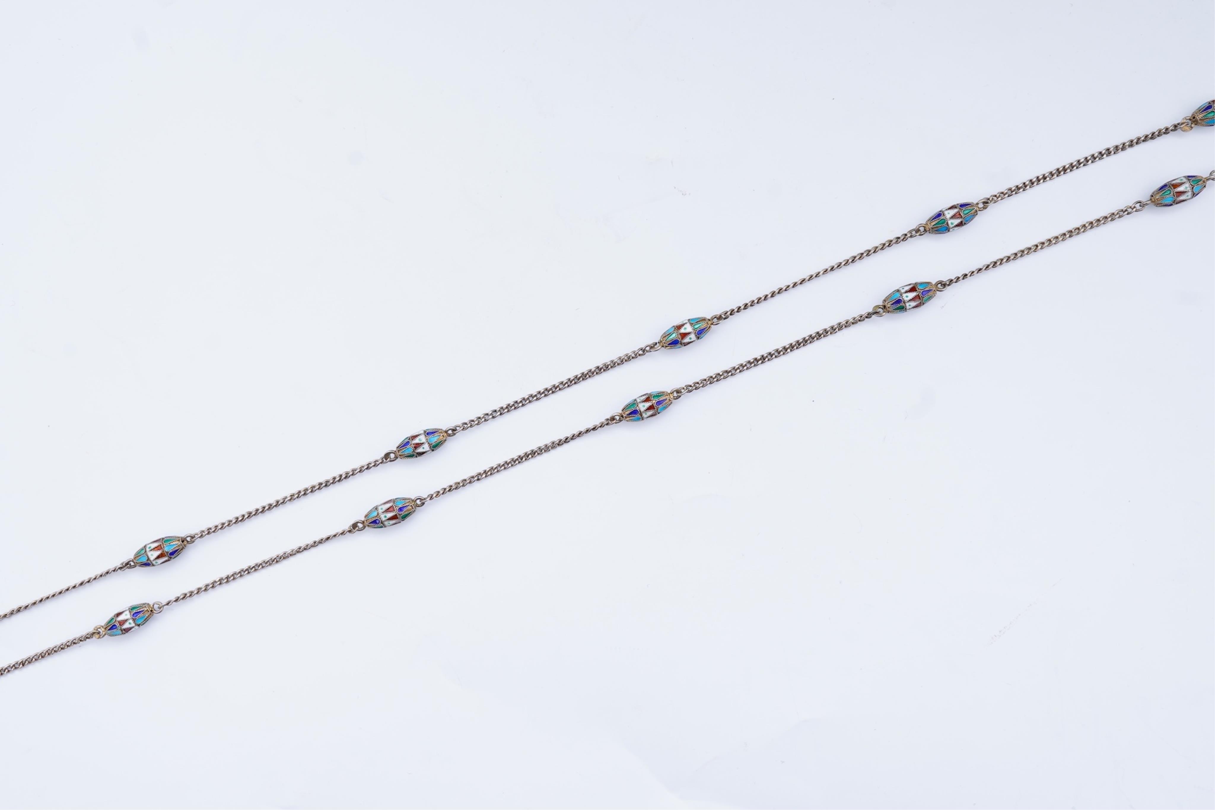A silver and enamel long chain necklace, Russia, early 20th century